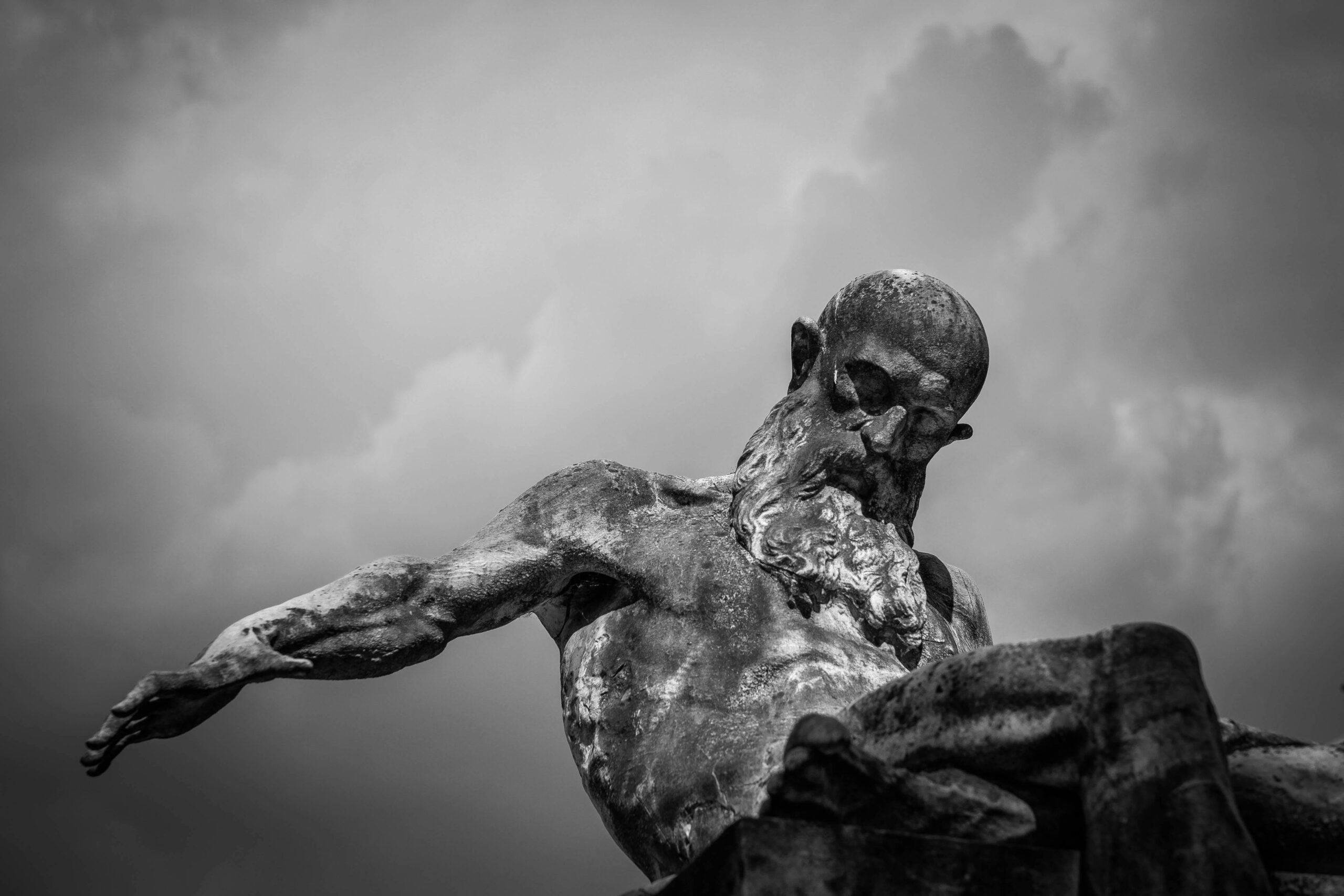 pexels-photo-96446-96446 Grayscale Photo of Gray Man Statue
